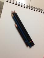 wooden pencils on paper