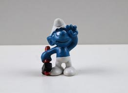 funny smurf figurine on the table