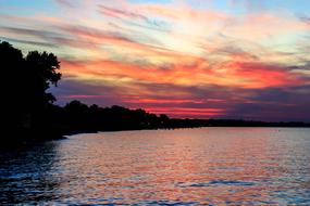 view of the lake and the colorful sky