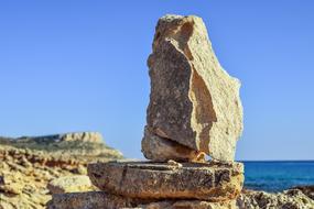 large rock on the beach by the sea