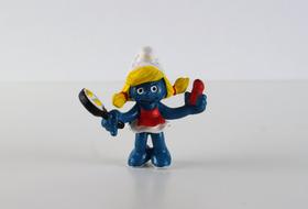 Smurf toy with frying pan