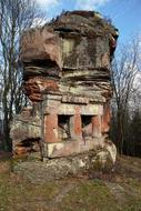 a ruined building in the forest