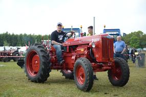 Man On Tractor Red Old