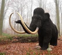 mammoth statue in the forest