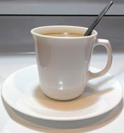 hot sweet coffee in a white mug