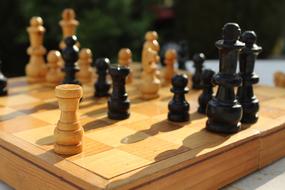 wooden chess pieces on the board