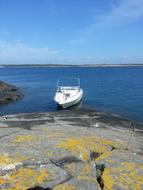 white boat on a blue lake