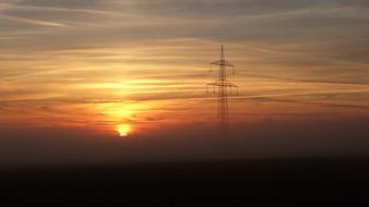sunrise over electric lines