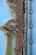 blue painted Rusty metal close up