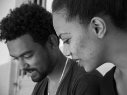 african american man and woman close up