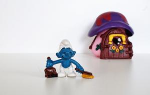 Smurf toy with a house