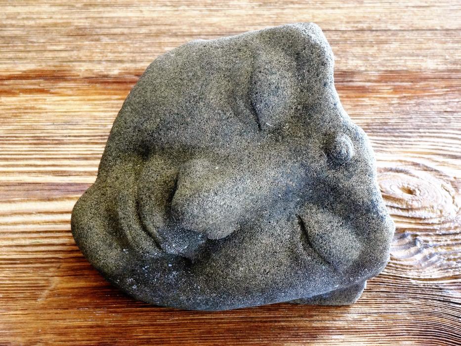 stone face of the statue