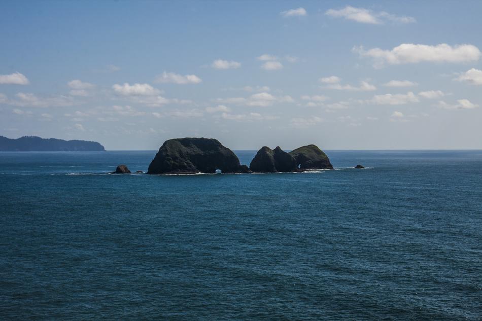 stones a lot of rocks blue ocean