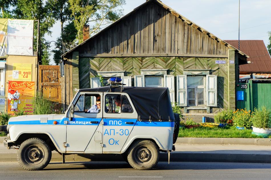 police car parked near a house in Novosibirsk