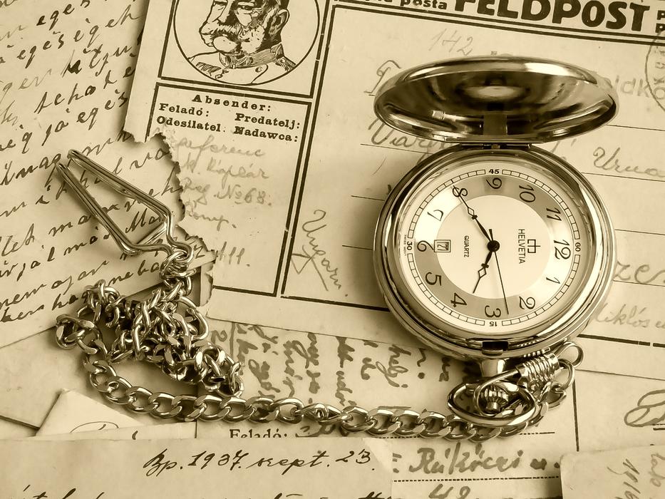 old pocket watch on paper