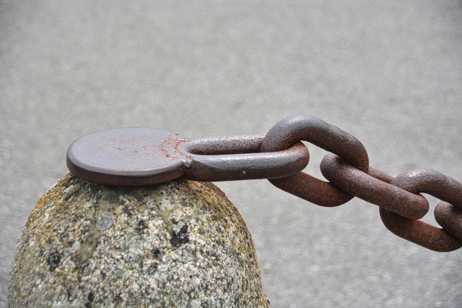 rusty chain on a rock