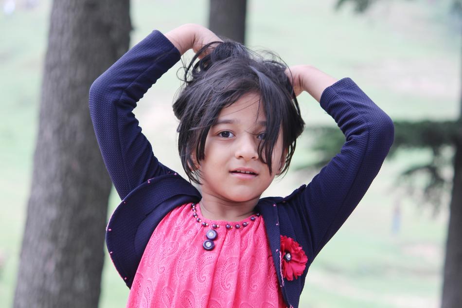 stylish indian girl near the tree