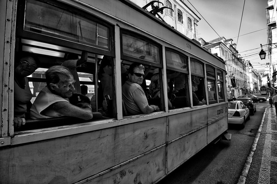 people watching from the streetcar