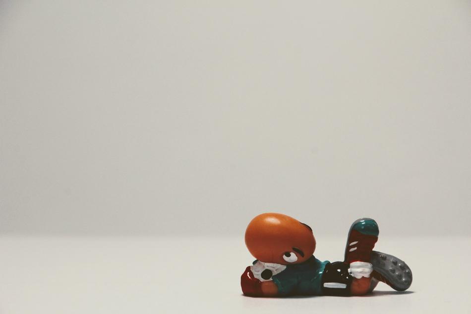 bill body anime character, funny footballer figurine at blur grey background