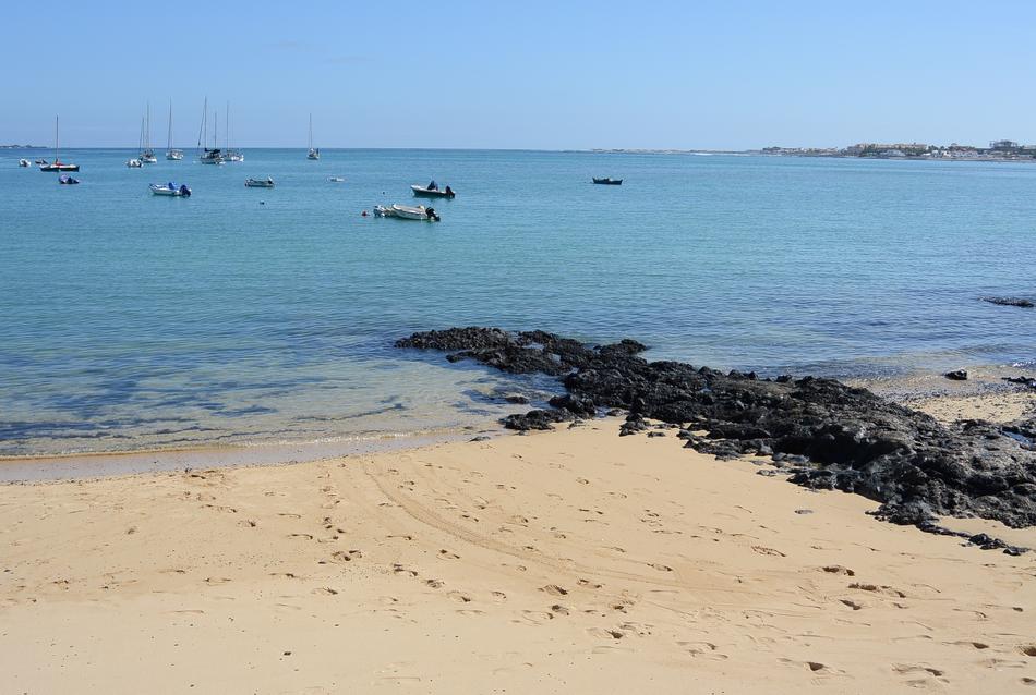 beautiful view of the beach by the ocean is beautiful