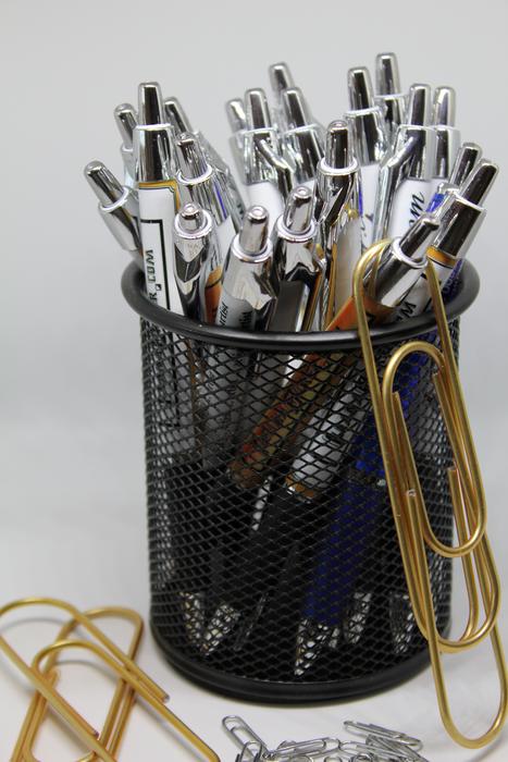 lot of office pens in a glass