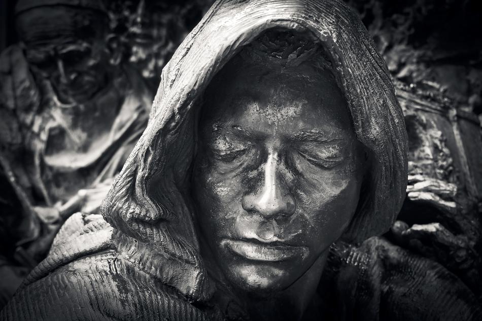 black and white photo of a monk's sculpture head in Dusseldorf