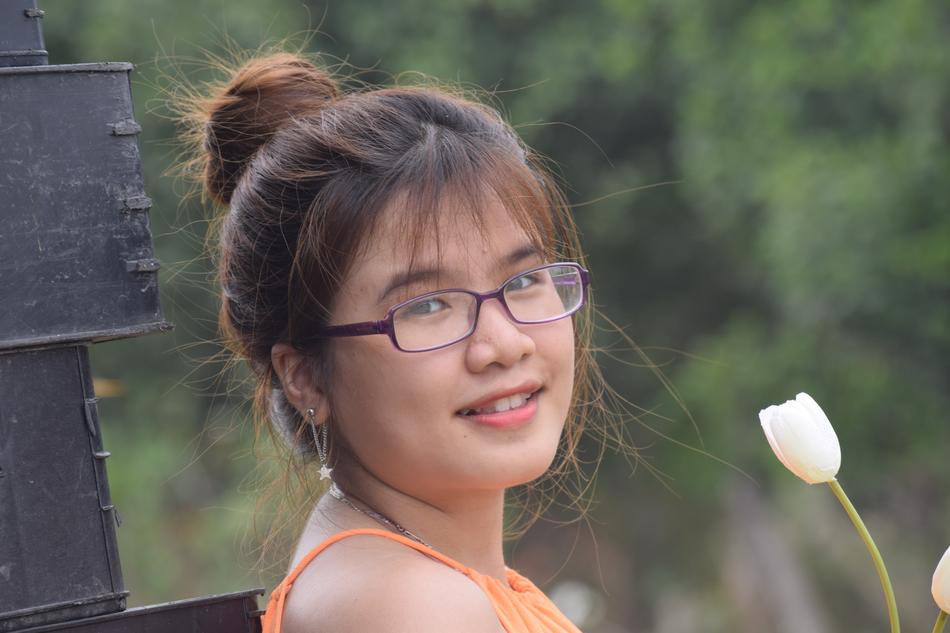 Portrait of Beautiful Girl with flower