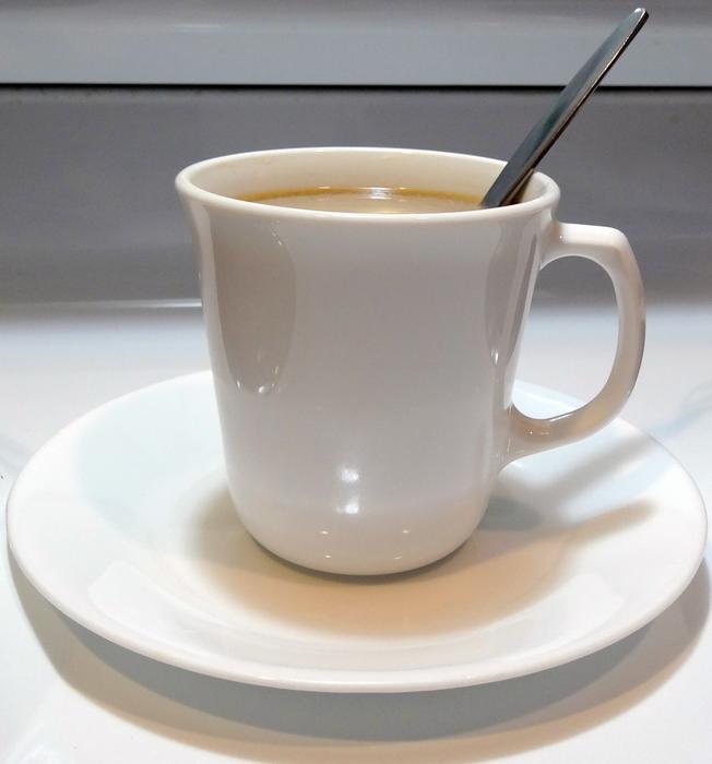 hot sweet coffee in a white mug