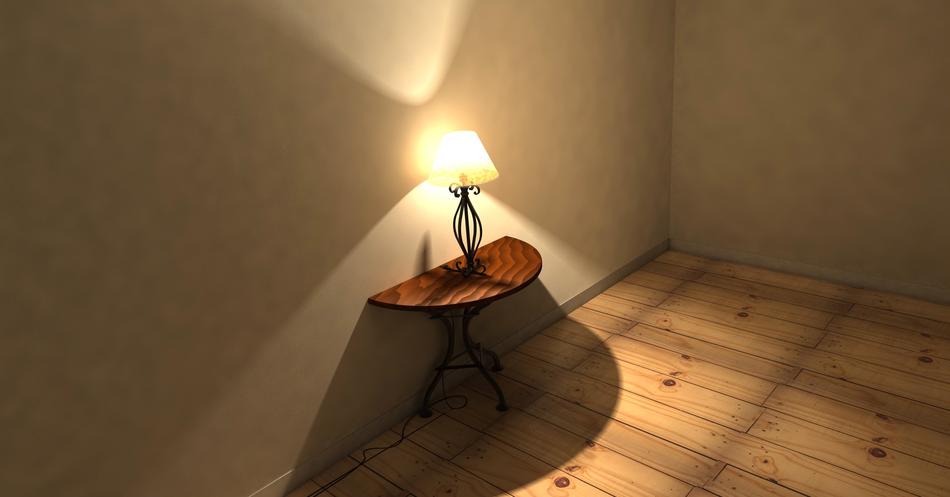 wooden table with a lamp near the wall