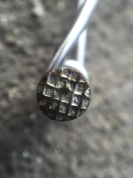 hammered nail in the wall