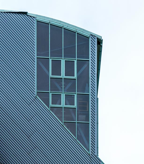Turquoise industrial plant with the windows