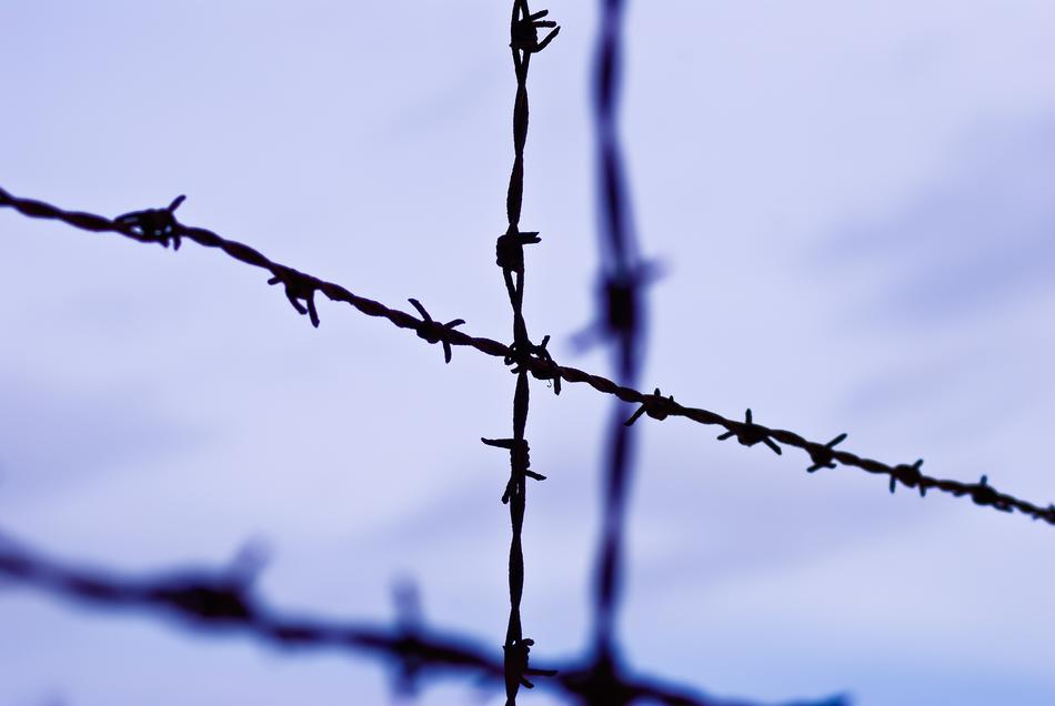 An iron fence against the sky