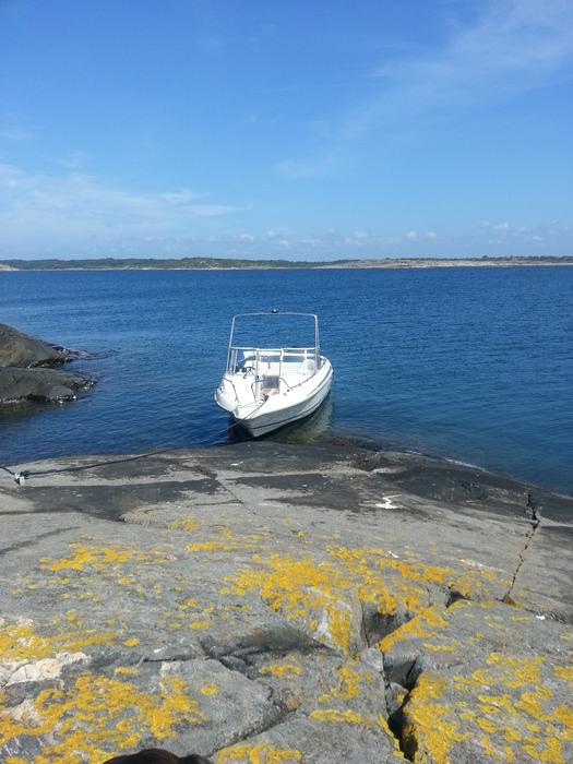 white boat on a blue lake