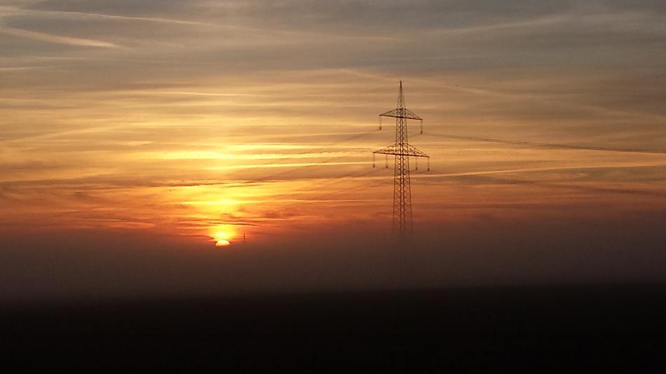 sunrise over electric lines