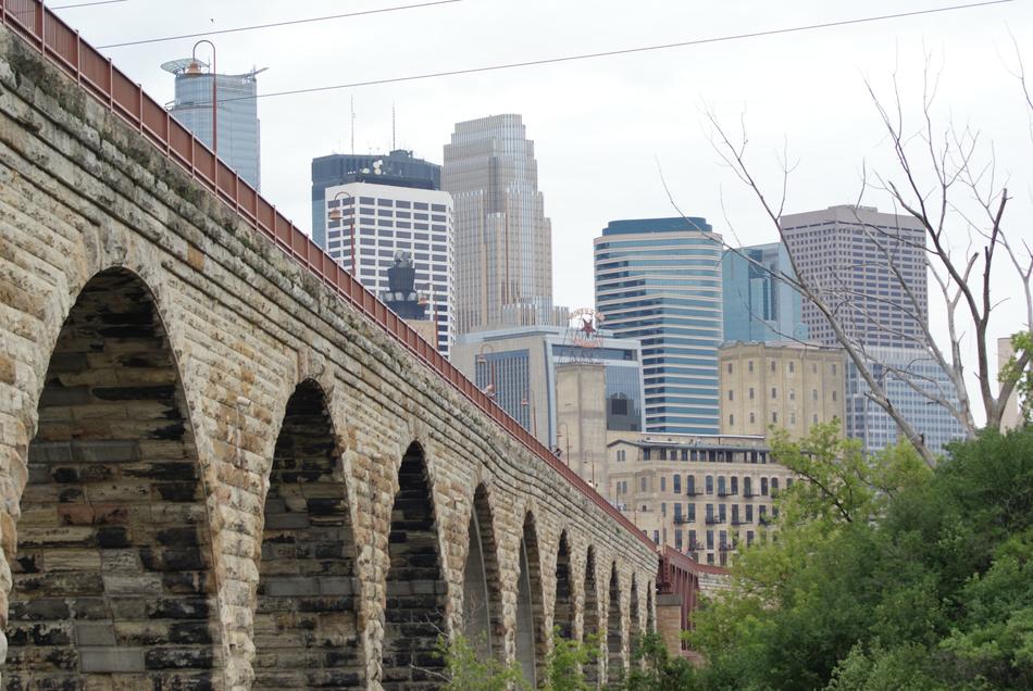 arched bridge by the city landscape