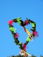 a heart of bushes against the sky