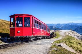 red train passing through the mountains