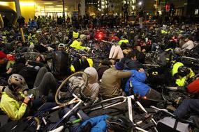 people sitting by the bikes