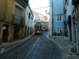 tram in the stone streets of lisbon