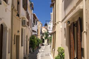 narrow street in greece on a sunny day