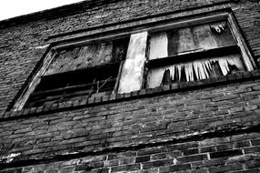 black and white photo of the facade of an abandoned factory