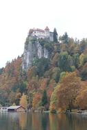 beautiful castle in the autumn trees