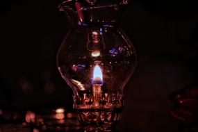 photo of an oil lamp in the dark