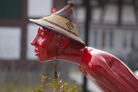 Red Sculpture Figure