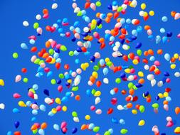 lot of bright Balloons at blue sky