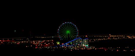 Beautiful and colorful cityscape with the Ferris wheel and lights, at night in Kurdistan