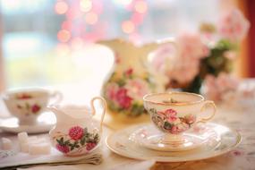 tea set with a picture of flowers on the table