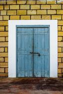 Wooden Door in brick Wall