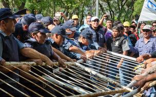 people holding the fence