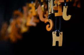 wooden letters on a black background